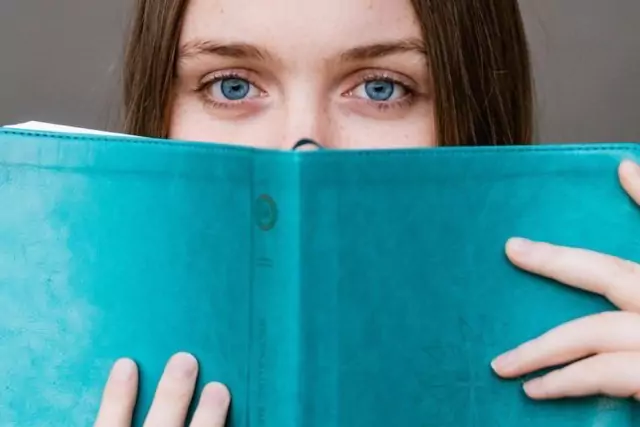 young woman holding a book